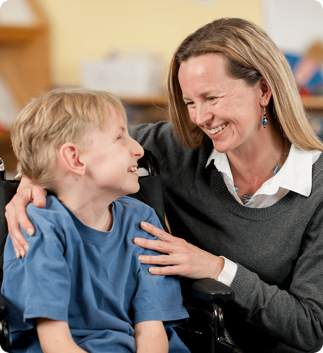 Woman and child smiling together warmly