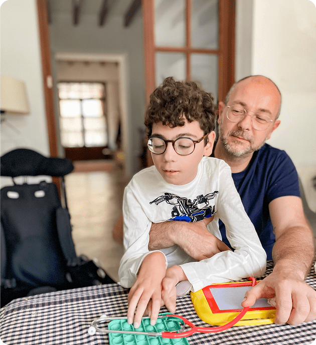Father assisting son with learning activity