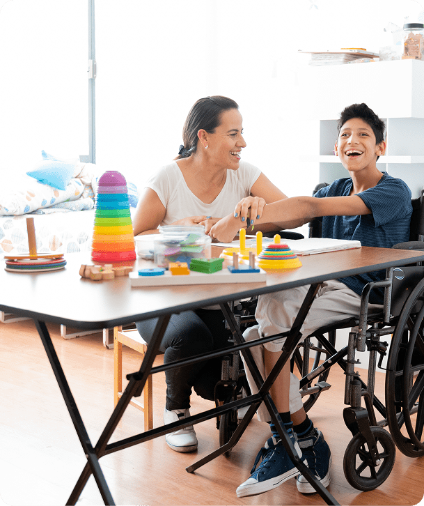 Woman and boy playing with toys