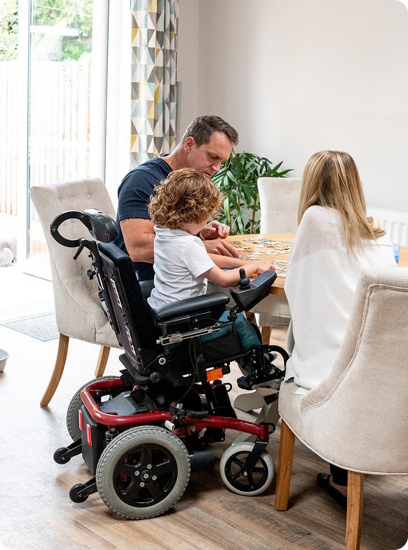 Parents and child enjoying board game